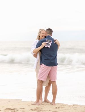a person standing on a sandy beach
